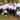 The Calibra team in a park with two team dogs